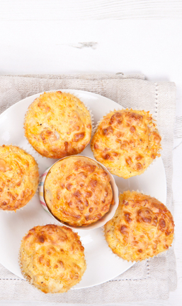 Savory cheese and bacon muffins on the white table